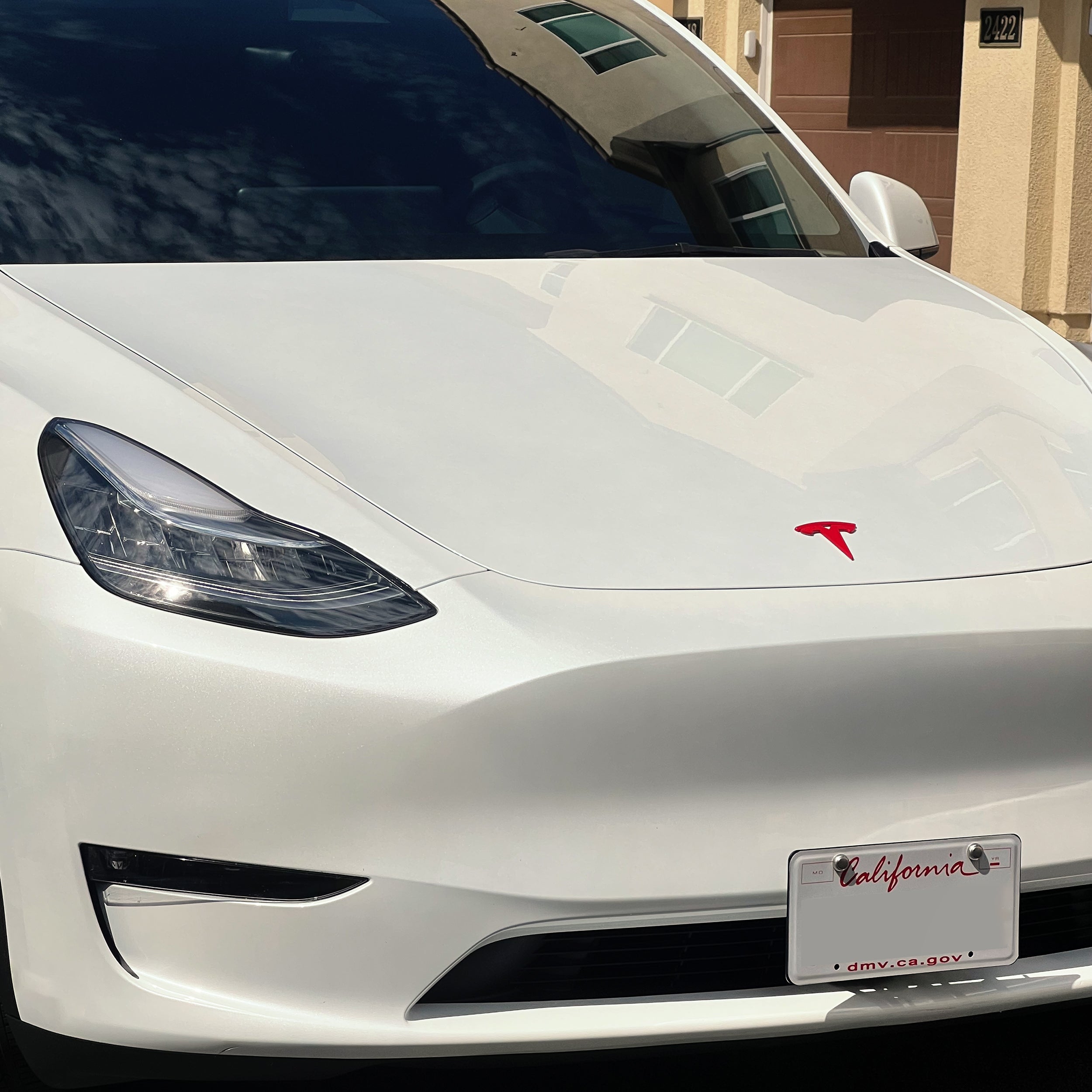 Glossy Red Tesla Logo Emblem Cover